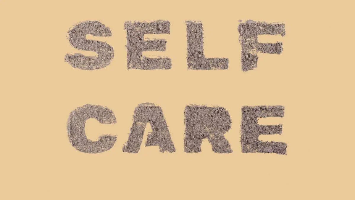 Super busy self-care tips: words "self-care" on beige background